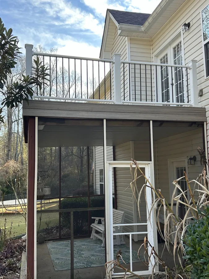 Two story deck with white railing above a screened porch, Griffin GA
