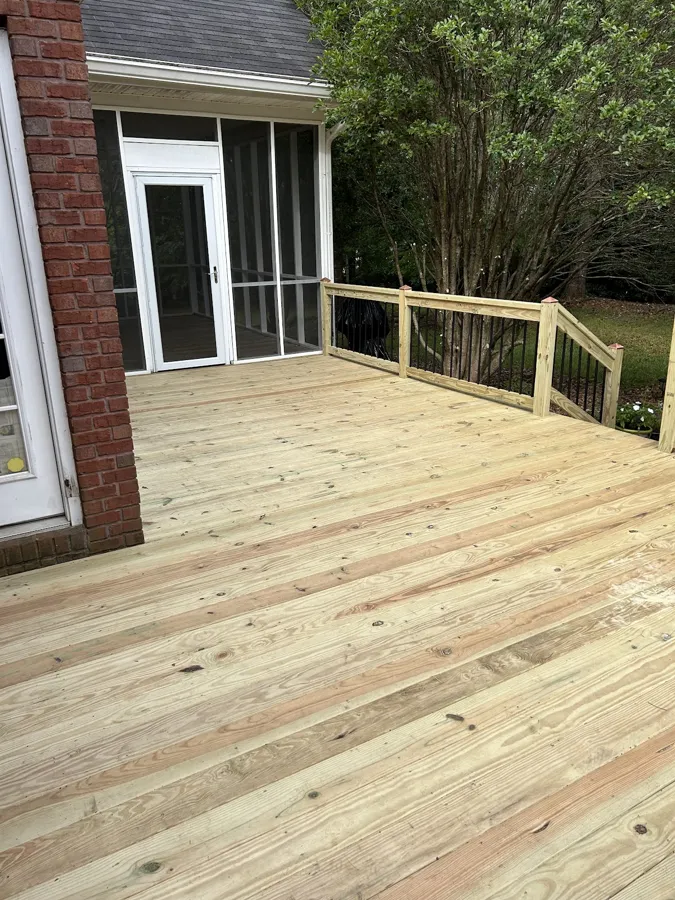 Newly built wood deck and steps leading to a screened porch in Griffin, GA